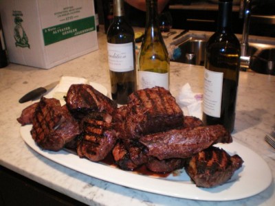 Cooked meat. Note the wine in the background.