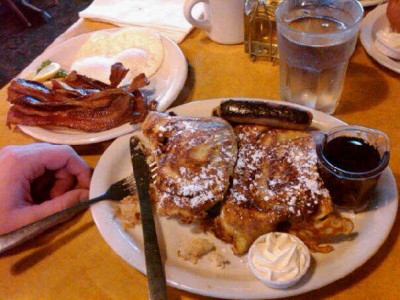 Eggs, bacon, sausage, and cinnamon roll french toast. Heaven.