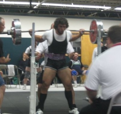 AC squatting in competition last November